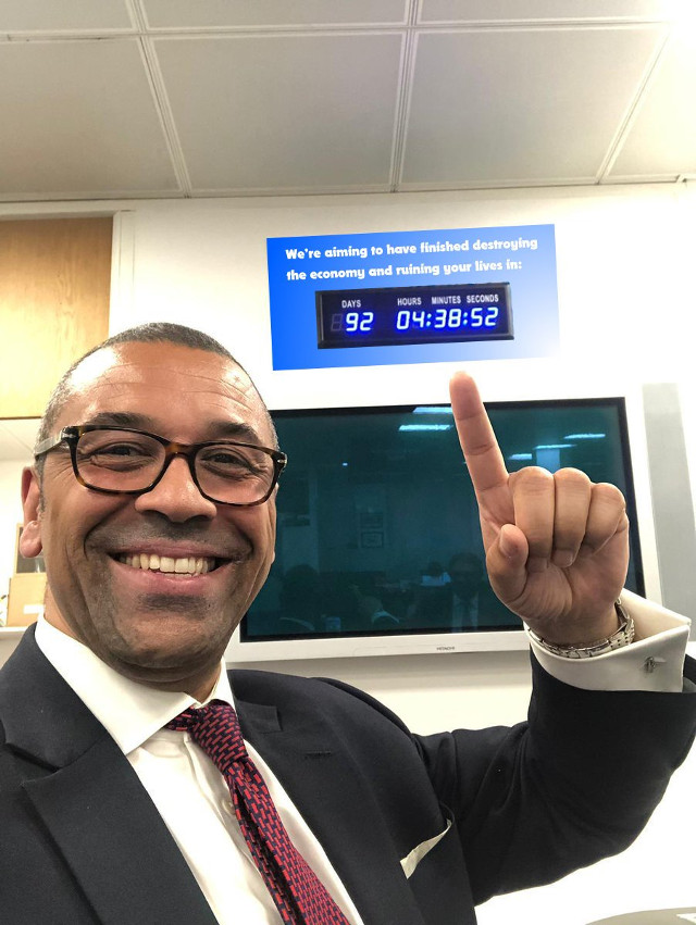 The ironically named James Cleverley pointing to the clock that counts down until the UK's ruin