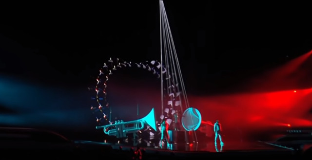Lights surrounding James Newman at Eurovision 2021