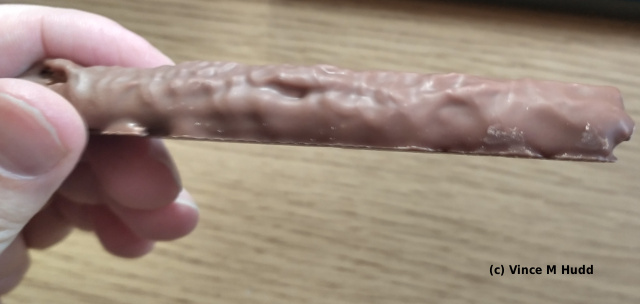 A single Cadbury Twirl bar opened, and beckoning me to eat it