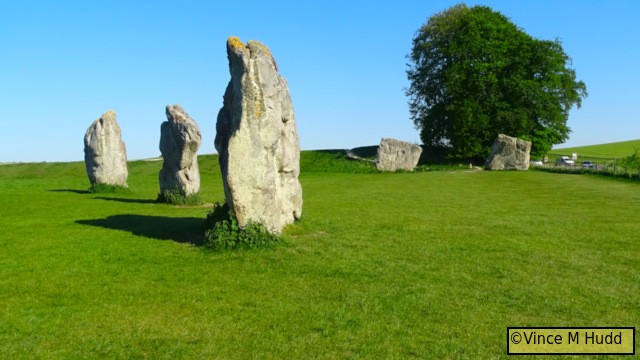 Three stones from one of the inner circles at Avebury, and in the distance two of the behemoths that formed part of the outer circle.